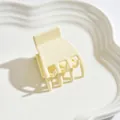 Elegant medium sized matte hair claw clip in creamy white finish for half-up hairstyles - Claw Clip Style / White