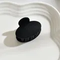 Classic matte black medium hair claw clip for elegant half-up hairstyles - Oval / Black