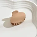 Classic matte beige medium hair claw clip for women displayed on white ceramic tray - Oval / Khaki