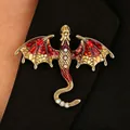 Vintage enamel dragon brooch with red wings pinned on black blazer - Flying Dragon Brooch (9401) / Gold Red