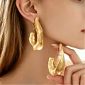 Elegant gold-toned exaggerated irregular geometric drop earrings featuring a hammered texture - Irregular Texture Style (10304) / KC Gold