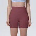 Detailed view of high waisted burgundy yoga shorts for women with tummy control fit - S / Wine Red