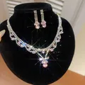 Luxe zilverkleurige sieradenset met roze druppelvormige strass ketting en oorbellen - Ketting En Oorbellen Set / Roze