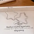 Minimalist silver-toned star-shaped hoop earrings with a stylish, modern aesthetic - Geometric Star Design (58# 925 Sterling Silver Earring Post) / Silver