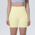 Front close-up view of high-waist yoga shorts in pale yellow breathable fabric - S / Milk Yellow