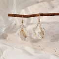 Elegant white acrylic petal earrings with gold edges hanging on a natural branch - White Gold-Edged Matte Petal Style (E5053)