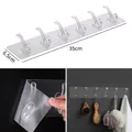 Transparent 6-hook adhesive wall rack for nail-free bathroom and kitchen storage - Transparent 6-Hook Strip (35 Silk)