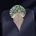 Broche élégante fleur de paon avec cristaux bleus et glands en strass brillants - Gland de méduse