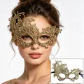 Close-up of the elegant gold filigree lace mask worn by a model for masquerade parties. - One Size / Gold Stamping