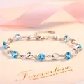 Élégant bracelet plaqué argent avec cristaux bleus en forme de cœur et zircons. - Bracelet Cœur / Zircone Bleue