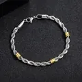 Men's stylish silver twisted rope chain bracelet with three gold ring beads in steel - Twist Chain with Gold Beads