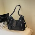 Stylish black large capacity shoulder bag with double wide straps and zipper detail. - Black