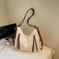 Large capacity cream shoulder bag with brown wide straps and tassel details - Off White