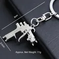 Llavero de mini pistola de pintura en metal plateado, dimensiones de 6 x 3,5 cm - Pistola de Pulverización Pequeña (A-23)