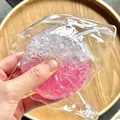 Close-up of handmade squeeze stress ball toy with pink and white crystalline texture - Two-tone Pink