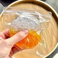 Handmade sugar texture ice squeeze toy for stress relief, shown held in a clear bag - Orange Patchwork