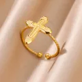 Detailed macro shot of 18K gold plated cross ring with twisted band design - Geometric Engraved Cross Style (12)