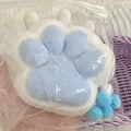 Close-up of a blue and white cat paw squishy toy in plastic packaging for stress relief - Blue White Plush Cat Paw / 12cm Thickened / Blue & White