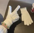 Cozy white knitted winter gloves featuring cute pom-pom trim and two-finger exposed design - Two Finger Open Knit Style / White