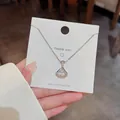 Silberne Titanstahlkette mit fächerförmigem Anhänger und tanzendem Stein auf einer Karte - Fächerförmiger Rockstil (X197) / 18K-Gold / Silber
