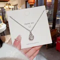 Elegante silberfarbene Titanstahl-Halskette mit funkelndem Tropfenanhänger für Damen - Tanzender Wassertropfenstil (X452) / Silber