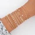 Luxuriöses 11-teiliges goldenes Armband-Set mit Perlen, Kristallen und Herzanhängern. - 11-teiliges Goldenes Kunstperlen-Schmuckset (6376401HB) / 11er Pack / Gold