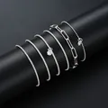 Elegantes 11-teiliges silbernes Mehrschicht-Armbandset mit Herz- und Kristallanhänger - 11-teiliges Twist-Perlen-Herz-Set (6078802) / 11er Pack / Silber