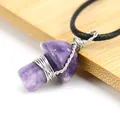 Detail view of a handmade wire wrapped purple crystal mushroom pendant on black cord. - Lilac (Amethyst)