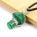 Macro view of handmade green malachite mushroom pendant necklace with wire wrap detail - Malachite
