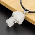 Close-up of handmade silver wire-wrapped natural white crystal mushroom pendant necklace. - White Crystal