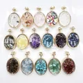 Macro view of 16 oval glass pendants containing various colorful natural crushed stones - Mixed Random