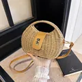 French retro woven straw crossbody bag with metal lock in a natural tan finish. - Khaki