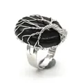 Detailed close-up of a handmade wire-wrapped tree of life ring featuring an oval black stone - Adjustable Open / Black Agate