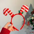Diadema navideña de bastón de caramelo a rayas rojas y blancas con detalle de acebo - Diadema de Bastón Doble de Navidad