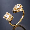 Detail of gold-plated open ring with pear and rectangular cubic zirconia stones - Ring / Gold