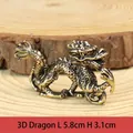 Detailed view of a miniature brass Chinese zodiac dragon figurine on a wood base. - Zodiac Dragon Ornament / Approx 41g