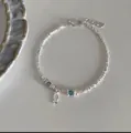 Delicate silver beaded bracelet featuring blue crystal beads and a cute fish charm - Silver Small Fish Pendant Style