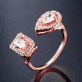 Elegant rose gold plated open ring with pear and emerald cut AAA zirconia stones - Ring / Rose Gold