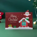 Tarjeta de felicitación navideña roja con Papá Noel de dibujos animados y casita - Papá Noel Rojo