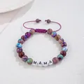 Detail view of a purple stone bead bracelet featuring white 'MAMA' letter beads - MaMa (Woven Style) / Adjustable
