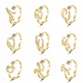 Detailed grid view of gold plated initial rings A-I with sparkling cubic zirconia accents - Letter A / Gold