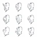Detail view of nine adjustable silver-tone rings featuring pavé-set letters from A to I - Letter A / White Gold