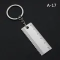 Mini llavero de regla de acero inoxidable con escala de 5 cm y borde dentado decorativo - Regla (A-17)