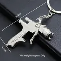 Llavero mini pistola de pulverización en metal plateado con marcas de dimensiones - Pistola de Pulverización Grande (A-24)