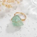 Close-up of handmade gold wire wrapped ring with a large irregular raw green stone. - Adjustable Open / Green Aventurine