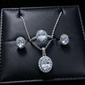 Close-up of oval halo moissanite jewelry set including necklace, ring, and earrings - 3-Piece Set (T16) / White