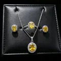 Detailed shot of yellow oval moissanite jewelry set including ring and necklace - 3-Piece Set (T16) / Yellow