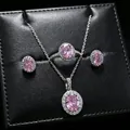 Detailed view of pink oval gemstone jewelry set including necklace, ring, and earrings - 3-Piece Set (T16) / Pink