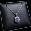 Detailed view of an elegant oval purple gemstone pendant necklace on black leather jewelry box - Pendant Necklace (T16) / Purple
