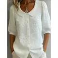 Elegant white blouse with large floral embroidery and a vintage Peter Pan collar style - White